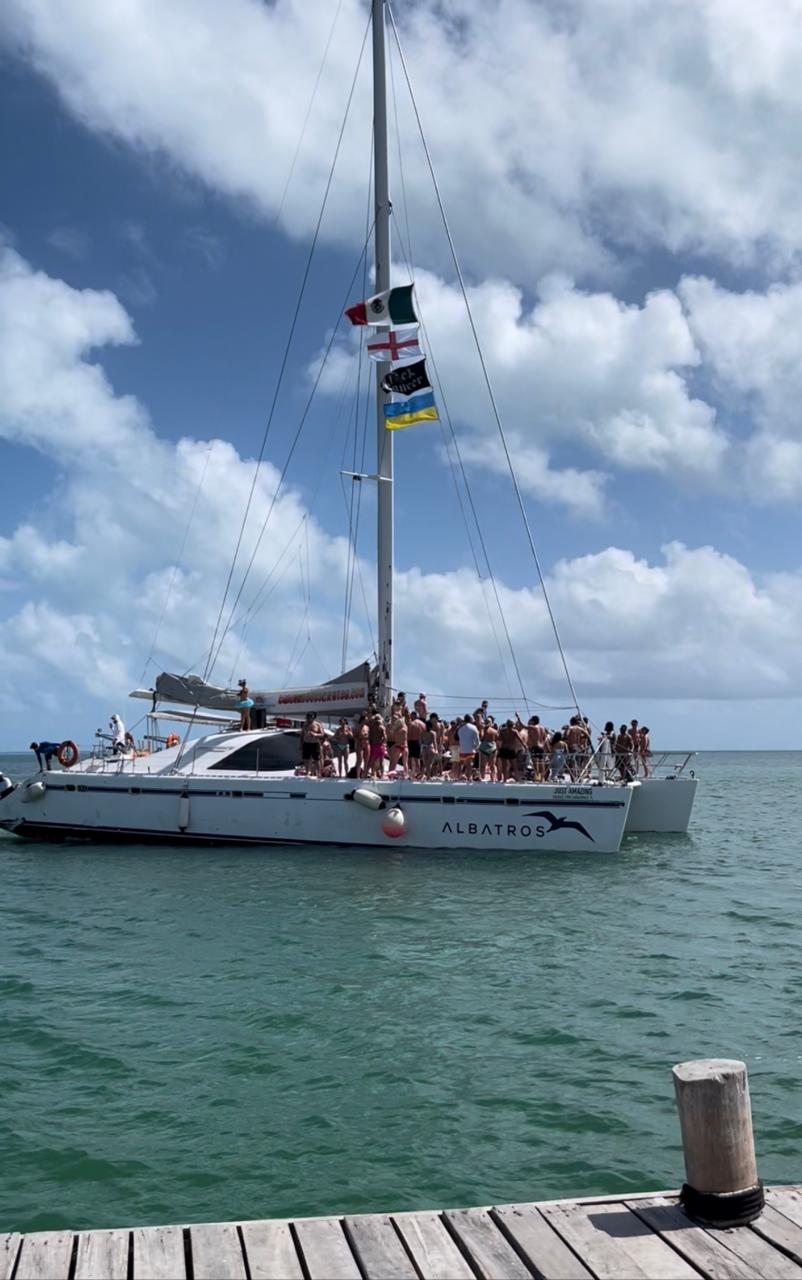 Guests aboard the Albatros catamaran on the Cancun Boobs Cruise